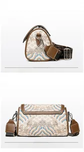 Front and back views of an ivory embroidered Boston bag with brown leather trim details