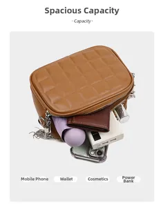 Internal capacity of the brown quilted chain bag showing space for essentials
