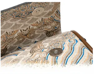 Detail of silver cylindrical magnetic clasp on Chinese style embroidered pillow bag