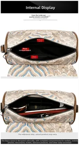 Detailed interior of the embroidered cylinder bag showing main pocket and zipper compartments