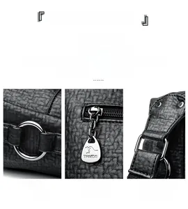 Detailed view of black lychee leather texture with silver kangaroo zipper and hardware