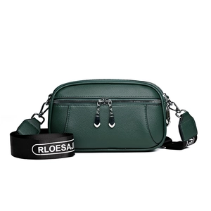 Minimalist dark green crossbody bag with textured leather and dual silver zippers