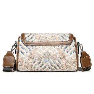 Retro Chinese style embroidered cylinder bag with cloud patterns and brown leather trim
