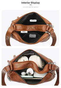 Dettaglio dell'interno della borsa in pelle PU marrone con scomparti multipli e cerniera