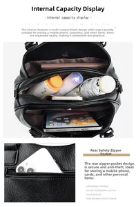 Detail of the black leather bag with three compartments and a secure back zipper pocket