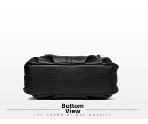 Detailed view of the reinforced base stitching on a black soft leather handbag