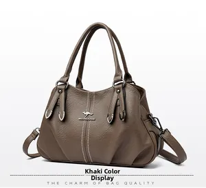 Detail view of khaki faux leather tote bag with lychee texture and kangaroo logo