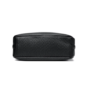 Bottom view of black lychee grain leather shoulder bag with durable stitching details