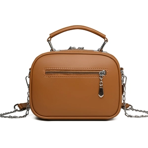 Brown faux leather crossbody bag with chain strap and top handle on white background