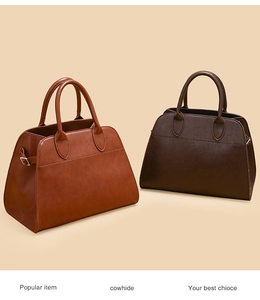 Detailed close-up of brown and dark coffee cowhide leather tote bags with metal buckles