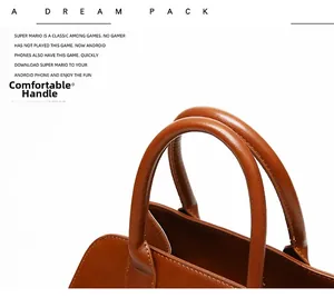 Detail of comfortable brown leather handles on a large capacity vintage tote handbag