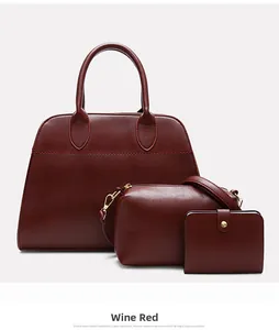 Three-piece set of burgundy leather tote bag with crossbody pouch and small wallet