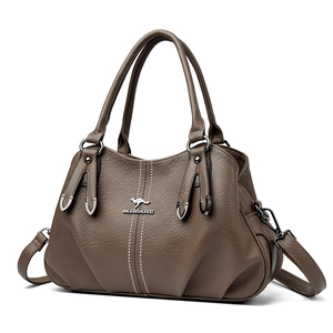 Brown soft leather tote bag with three compartments and adjustable strap for women