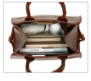 Flat lay of vintage brown tote bag showing large capacity for tablet and daily items