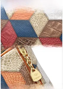 Detailed view of hexagonal patchwork PU leather texture and gold kangaroo logo zipper