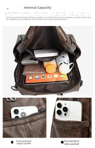 Detail view of large capacity vintage backpack interior showing multi-compartment storage