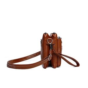 Brown multi-layer faux leather shoulder bag with three zipper compartments side view