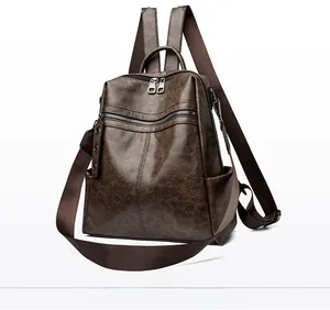 Side view of dark brown vintage oil-wax leather backpack with multi-zipper compartments