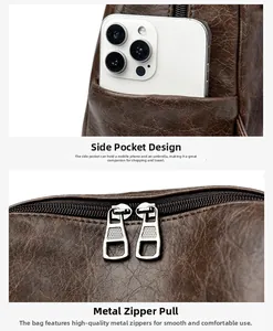 Detail of dark brown vintage backpack showing side pocket for phone and metal dual zippers