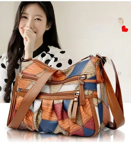 Dettaglio borsa in pelle patchwork colorata con texture di struzzo e coccodrillo