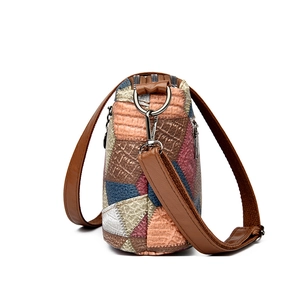 Multicolor patchwork leather crossbody bag with triple zippers and adjustable strap