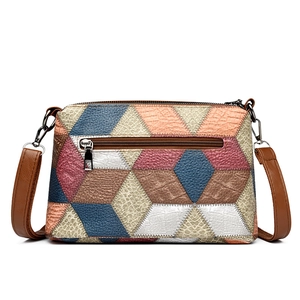 Women's multi-color patchwork faux leather shoulder bag with geometric pattern and top handle