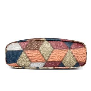Multi-color patchwork shoulder bag featuring embossed crocodile pattern and stitching