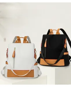 Macro shot of stylish dual-color waterproof nylon backpacks with brown leather accents