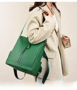 Green textured PU leather backpack side view on model with adjustable nylon strap