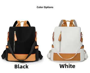 Detailed comparison of black and white backpacks with stylish brown leather stitching accents