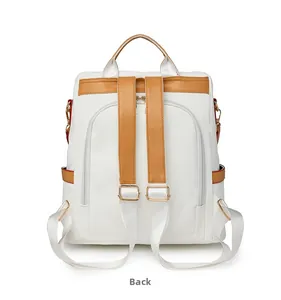 Back view of anti-theft backpack showing hidden rear zipper and tan leather accents