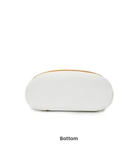 Detailed bottom view of the white travel backpack with elegant brown leather edge trim