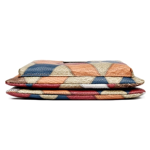 Retro multi-color patchwork clutch bag with embossed texture and crossbody strap