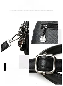 Detail of silver metallic hardware including kangaroo zipper pull and metal hooks
