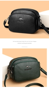 Detail of three-layer crossbody bag featuring lychee grain leather and kangaroo logo