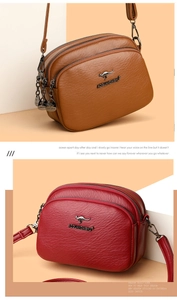 Macro detail of soft pebble grain leather texture and metallic kangaroo logo on small crossbody bags