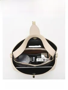 Interior view of beige large tote bag showing multi-compartment storage for iPad and umbrella