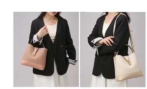 Detail of two-tone bucket bag with metal twist lock and detachable long shoulder strap