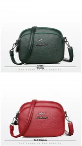 Close-up of three-layered zippers and lychee grain texture on green and red bags