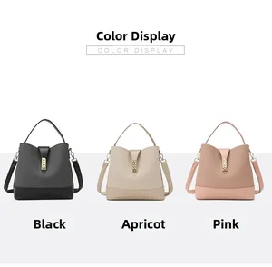 Three-color display of woven leather bucket bags in black, apricot and pink with metal locks