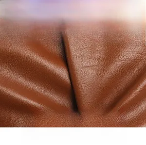 Detail of soft brown faux leather showing fine lychee texture and scratch-resistant finish