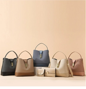 Detail of woven texture handbag set with gold metallic buckle in multiple colors