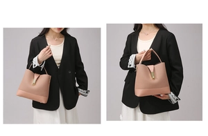 Detail view of pink leather bucket bag with gold rotary clasp and elegant top handle