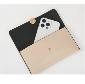 Detail of multi-functional envelope clutch showing interior space for large smartphone