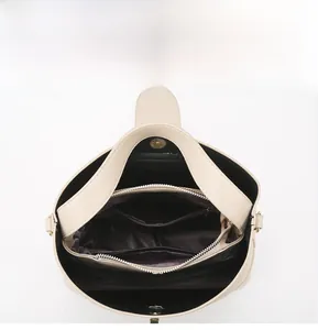 Internal layout of the tote bag showing multi-compartment storage and zipper pockets