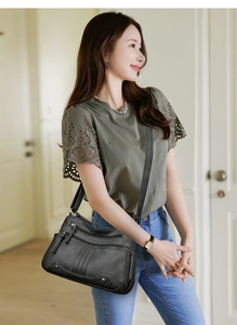 Sac à bandoulière en similicuir noir pour femme avec plusieurs compartiments zippés
