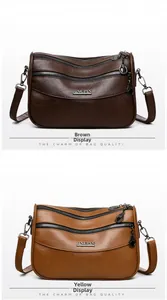 Detail of multi-layer leather crossbody bags in brown and tan with gold hardware accents