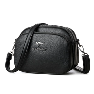 Crossbody black faux leather shoulder bag with multiple compartments and adjustable strap