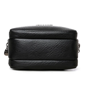 Black pebbled leather crossbody bag with multiple zippers and side pendant detail