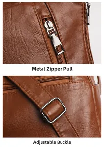Macro details of brown pebble leather bag showing silver metal zippers and adjustable buckle